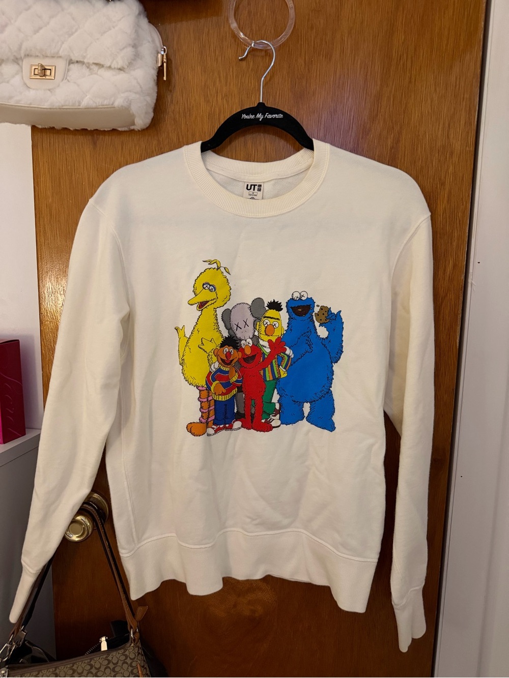 KAWS Cream Crewneck Sweatshirt with Multicolor Sesame Street Graphic
